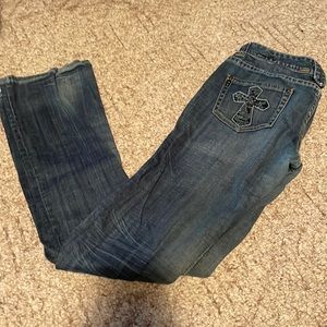 Rock and roll cowgirl riding jeans